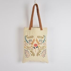 Botanical hand embroidered tote bag